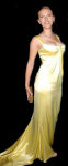 Different pictures of the great american actress Scarlett Johansson, posing sexy with a stunning golden dress.