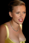 Different pictures of the great american actress Scarlett Johansson, posing sexy with a stunning golden dress.